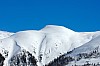 Aussicht vom Chalet auf die verschneiten Berge Thumb